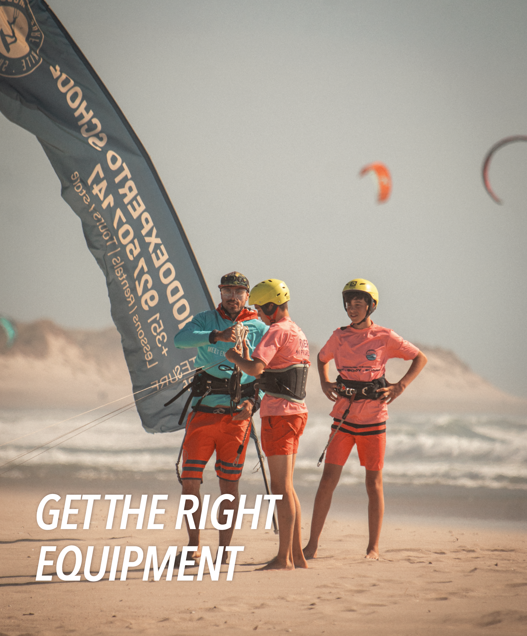 group of students learning kite at the beach