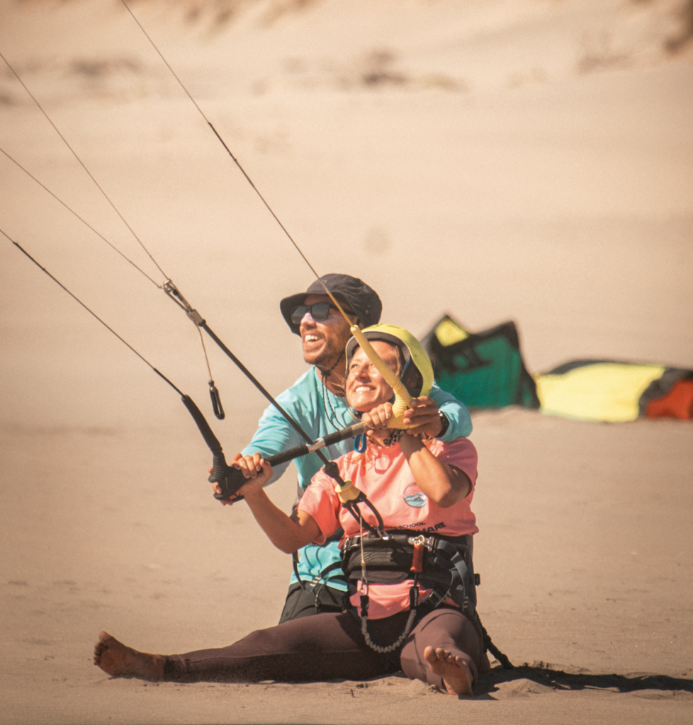 girl taking kitesurf lessons with our instructor