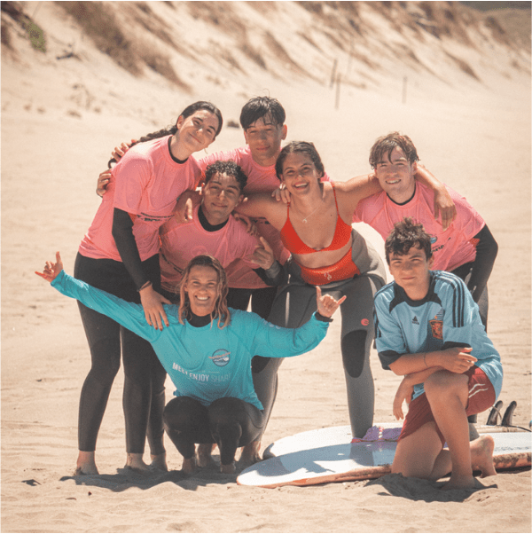 Friends taking surf lessons with our instructor juli