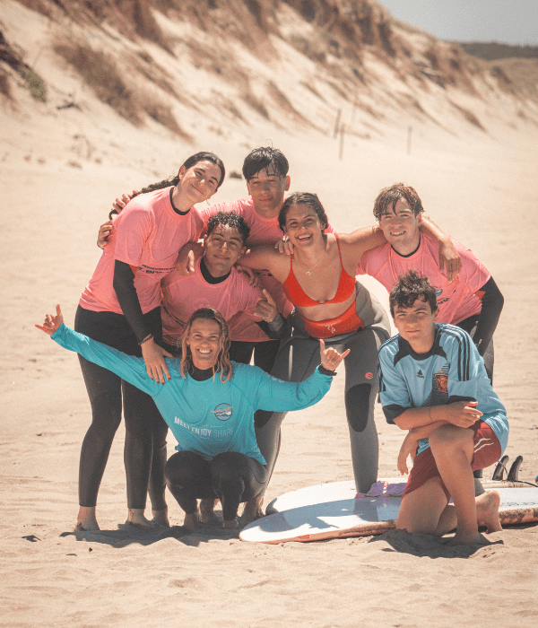 Friends taking surf lessons with our instructor juli