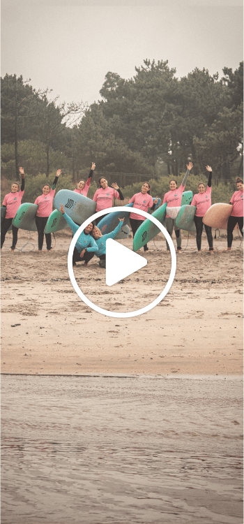 Group of girls taking lessons together on the beach