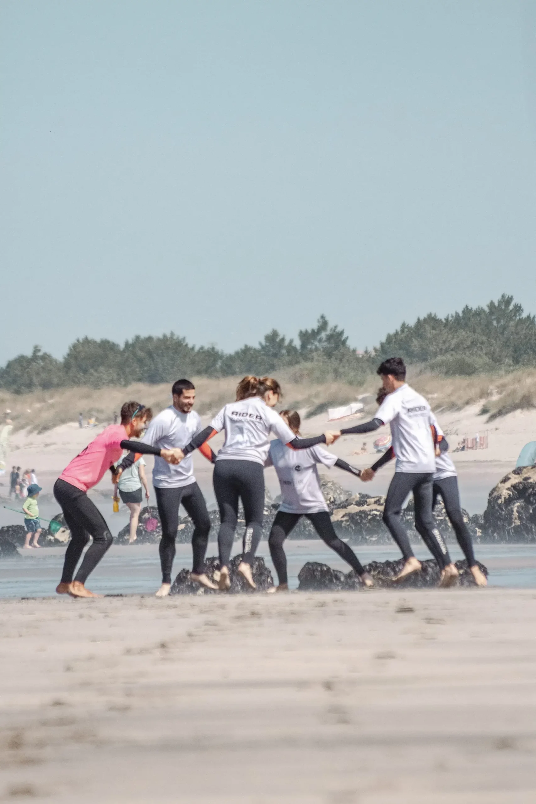Friends taking surf lessons with our instructor